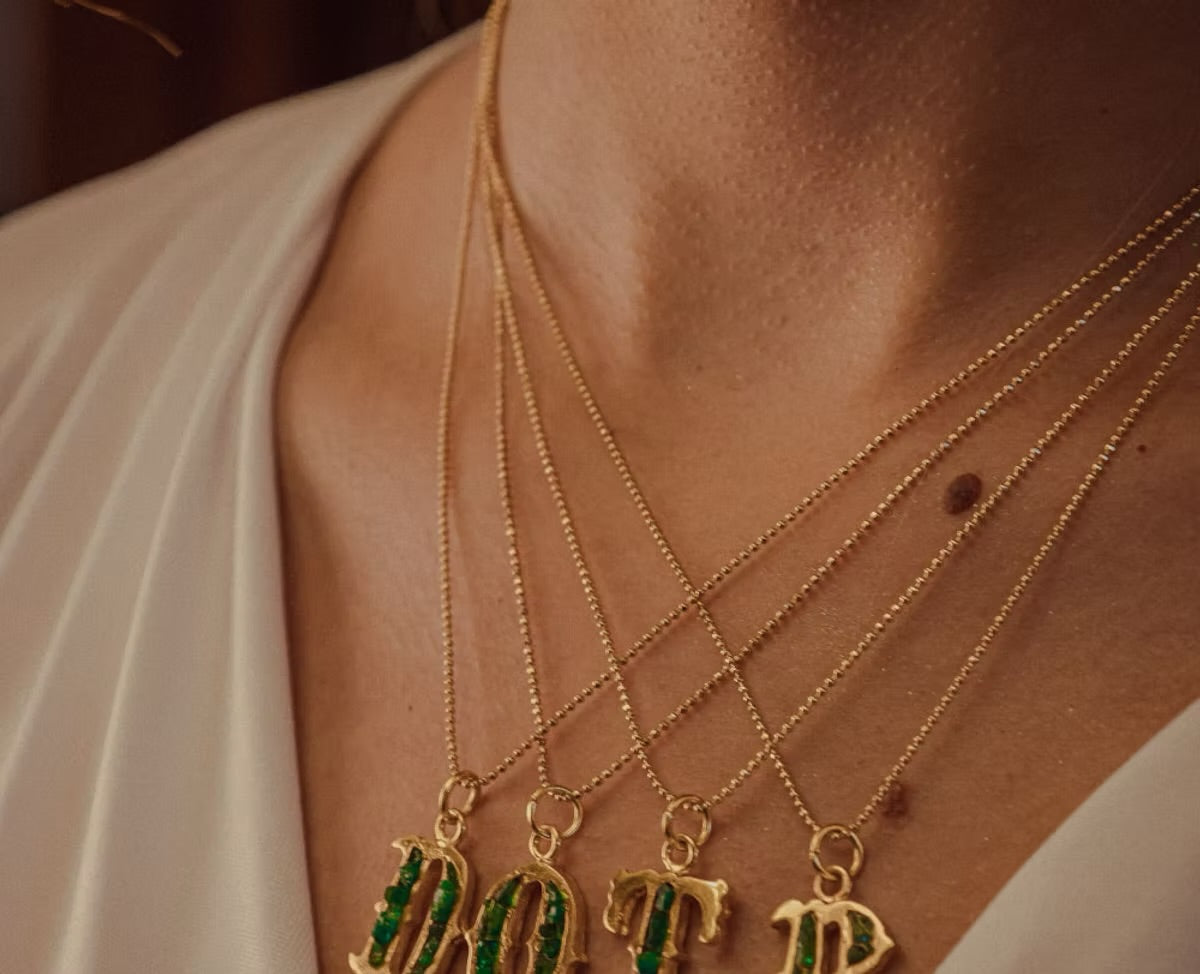 Letter pendant with resin-coated emerald chain coin