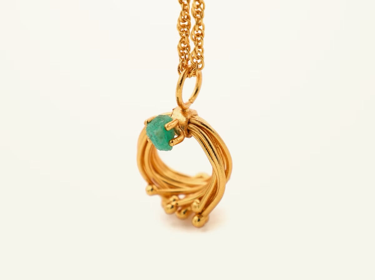 I said with emerald pins on a chain